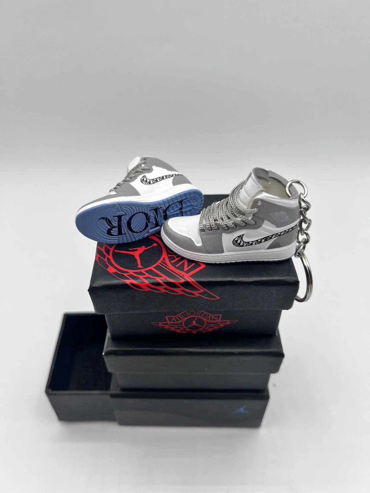 A Pair Of DIOR AIR Jordan 3D Mini Sizeneaker Keychain Perfect for Nike and Dior Enthusiasts/ With Sizehoe Box